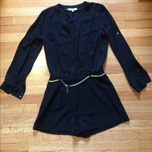 Long sleeved, belted, black romper. Size 6